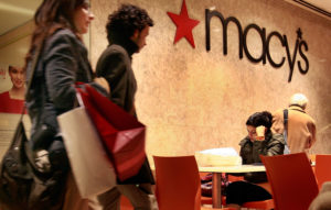 CHICAGO - FEBRUARY 02: Customers leave a Macy's store along the Magnificent Mile February 2, 2009 in Chicago, Illinois. Today Macy's Inc. announced that it will cut nearly 4 percent of its workforce, 7,000 jobs, and cut owners dividends by 8.25 cents to 5 cents. (Photo by Scott Olson/Getty Images)