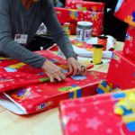 A member of the charity association "Les Restos du Coeur" wraps Christmas gifts in a toys shop on December 15, 2012 in Saint-Pierre-des-Corps, near Tours. AFP PHOTO/ALAIN JOCARD (Photo credit should read ALAIN JOCARD/AFP/Getty Images)