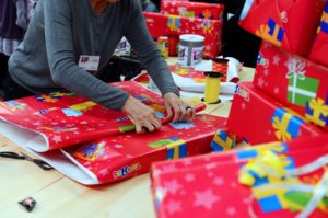 A member of the charity association "Les Restos du Coeur" wraps Christmas gifts in a toys shop on December 15, 2012 in Saint-Pierre-des-Corps, near Tours. AFP PHOTO/ALAIN JOCARD (Photo credit should read ALAIN JOCARD/AFP/Getty Images)