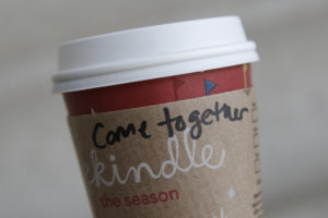 WASHINGTON, DC - DECEMBER 27: A cup of coffee with the words "come together" is seen at the Union Station location of Starbucks, on December 27, 2012 in Washington, DC. Starbucks CEO Howard Schultz says the words are intended as a message to lawmakers about the damage being caused by the divisive negotiations over the "fiscal cliff." (Photo by Drew Angerer/Getty Images)