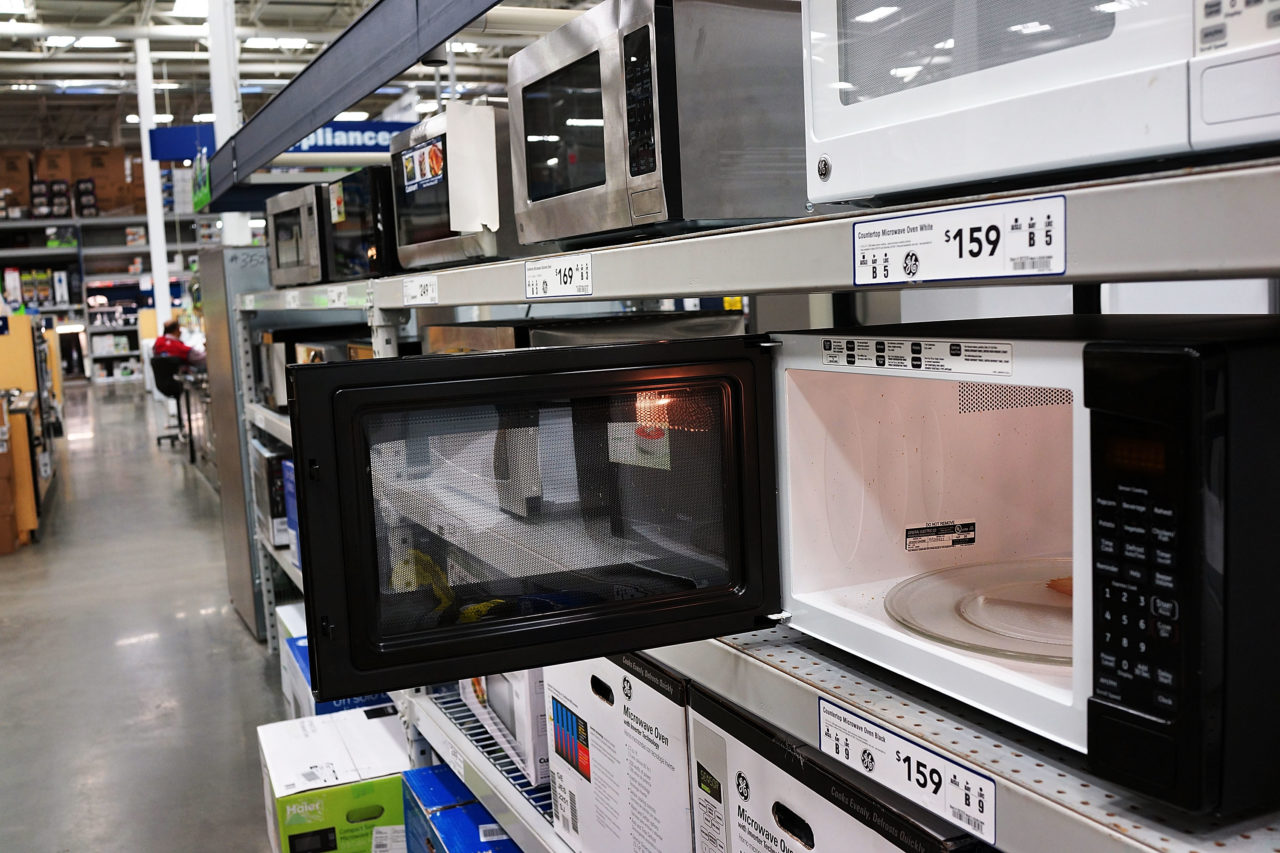 NEW YORK, NY - AUGUST 26: Microwave ovens are on display in a home furnishing store on August 26, 2013 in New York City. A report on Monday showed that sales of durable goods recorded their biggest drop in nearly a year in July. Items including computers, defense equipment and home appliances saw a 7.3 percent drop according to the Commerce Department.