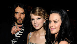 BEVERLY HILLS, CA - JANUARY 30: Comedian Russell Brand, singer Taylor Swift and singer Katy Perry during the 52nd Annual GRAMMY Awards - Salute To Icons Honoring Doug Morris held at The Beverly Hilton Hotel on January 30, 2010 in Beverly Hills, California.