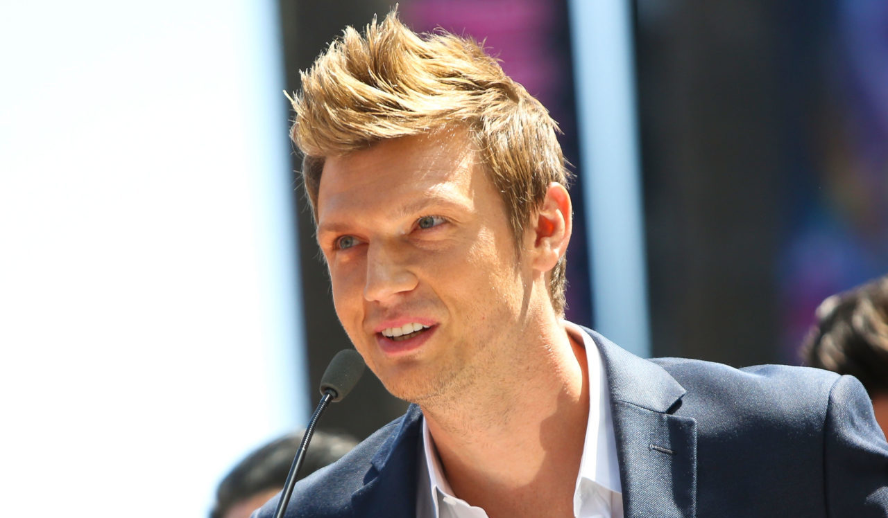 HOLLYWOOD, CA - APRIL 22: Singer Nick Carter of Backstreet Boys speaks onstage at the ceremony honoring them with a star on The Hollywood Walk of Fame held on April 22, 2013 in Hollywood, California.