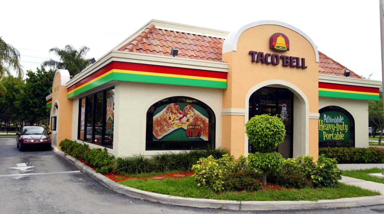 DAVIE, FL - JUNE 14: A woman leaves a Taco Bell restaurant June 14, 2002 where "dirty" bomb suspect Jose Padilla worked for two years in Davie, Florida. His former boss Mohammed Javed says while working as a manager of the restaurant, Jose Padilla was hired in 1992 after his release from a Broward County jail. Padilla, also known as Abdullah al Muhajir, is being held on suspicion of plotting a radioactive "dirty" bomb attack in the U.S. (Photo by Joe Raedle/Getty Images)