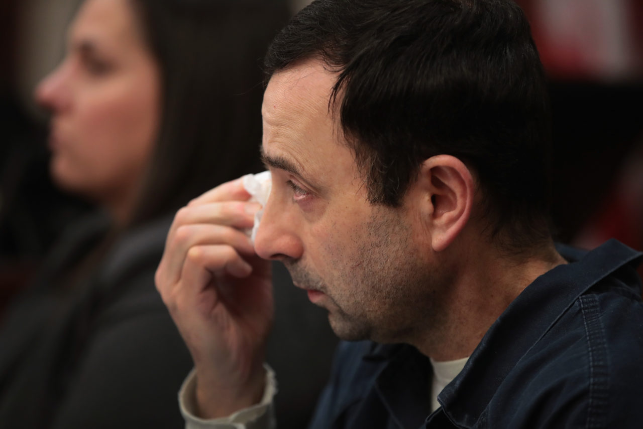 LANSING, MI - JANUARY 17: Larry Nassar wipes a tear as he listens to Carrie Hogan deliver a victim impact statement at his sentencing hearing on January 17, 2018 in Lansing, Michigan. Nassar has pleaded guilty in Ingham County, Michigan, to sexually assaulting seven girls, but the judge is allowing 101 ofl his accusers to speak. Nassar is currently serving a 60-year sentence in federal prison for possession of child pornography.