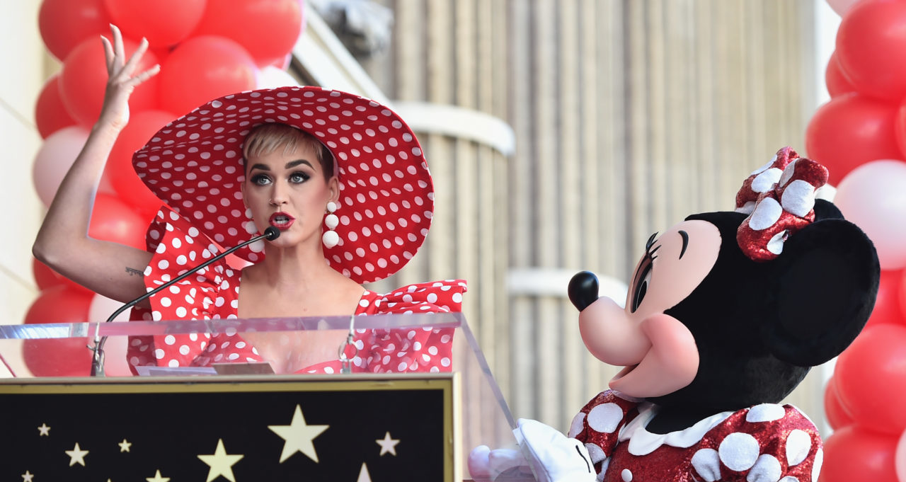 HOLLYWOOD, CA - JANUARY 22: Singer Katy Perry speaks on stage next to Minnie Mouse during a star ceremony in celebration of the 90th anniversary of Disney's Minnie Mouse at the Hollywood Walk of Fame on January 22, 2018 in Hollywood, California.