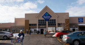 ROLLING MEADOWS, IL - JANUARY 12: Shoppers leave a Sam's Club store January 12, 2010 in Rolling Meadows, Illinois. Wal-Mart Stores Inc., the parent company of Sam's Club, announced that it will cut approximately 10 percent of its 110,000 Sam's Club workforce as it tries to revive the big box retailer's sagging sales. (Photo by Scott Olson/Getty Images)
