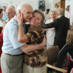 BERLIN, GERMANY - AUGUST 30: An elderly couple embrace while dancing during an afternoon get-together in the community room of the Sewanstrasse senior care home in Lichtenberg district on August 30, 2011 in Berlin, Germany. The center opens its doors to non-residents every Tuesday, and between 30 and 70 retired people who still live in their own homes in the local neighborhood come to dance and chat over coffee and cake. Today's afternoon dance is part of Senior Citizens' Week (Berliner Seniorenwoche), a city initiative meant to highlight activities available for the city's eldery. Germany is facing significant demographic change that includes elderly citizens making up an increasing portion of the overall population, a situation aggravated by the country's birth rate, which is the lowest in Europe. The shift will continue to put greater strain on the country's ability to finance its public health and senior care programs. (Photo by Sean Gallup/Getty Images)