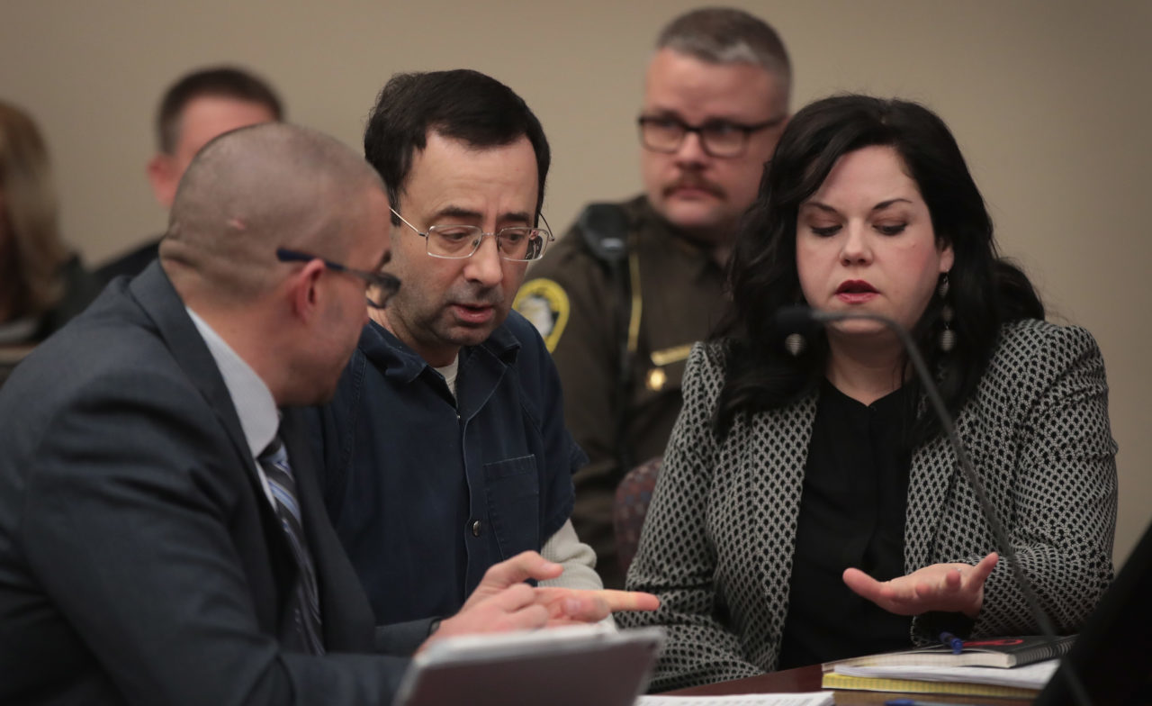 LANSING, MI - JANUARY 16: Larry Nassar (C) appears in court to listen to victim impact statements prior to being sentenced after being accused of molesting about 100 girls while he was a physician for USA Gymnastics and Michigan State University, where he had his sports-medicine practice on January 16, 2018 in Lansing, Michigan. Nassar has pleaded guilty in Ingham County, Michigan, to sexually assaulting seven girls, but the judge is allowing all his accusers to speak. Nassar is currently serving a 60-year sentence in federal prison for possession of child pornography.