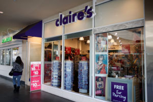 LOS ANGELES, CA - JANUARY 12: People pass a Claire's store on January 12, 2010 in the Hollywood community of Los Angeles, California. Claire's Stores has joined Wal-Mart to stop selling Chinese-made jewelry for girls in which high levels of the toxic metal cadmium have been found. The chain of 3,000 stores sells jewelry and accessories in 30 countries, on four continents. (Photo by David McNew/Getty Images)