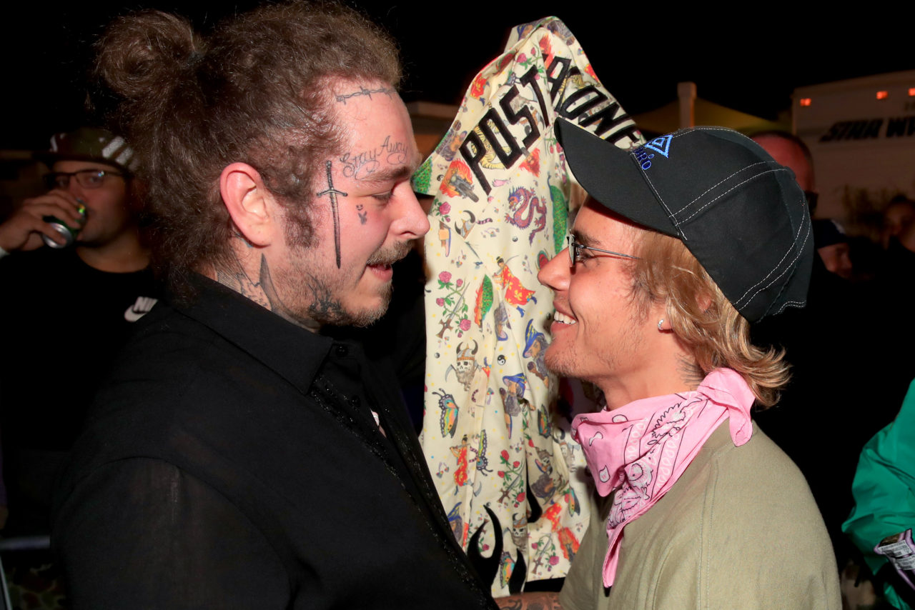 INDIO, CA - APRIL 14: Post Malone and Justin Bieber speak backstage during 2018 Coachella Valley Music And Arts Festival Weekend 1 at the Empire Polo Field on April 14, 2018 in Indio, California. (Photo by Christopher Polk/Getty Images for Coachella)