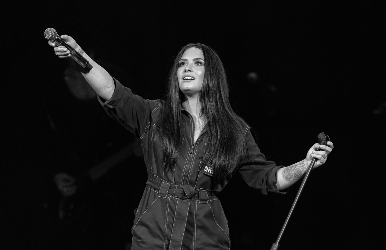 DALLAS, TX - FEBRUARY 09: (EDITORS NOTE: Image has been converted to black and white.) Demi Lovato performs live exclusively for American Airlines AAdvantage¨ Mastercard¨ cardmembers at House of Blues Dallas on Friday, February 9th in Dallas, TX. (Photo by Christopher Polk/Getty Images for Mastercard)