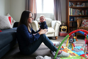 AUCKLAND, NEW ZEALAND - MAY 05: Secondary school teacher Sarah Ward at home on maternity leave with her three month old daughter Esme Kelliher, is in the last week of her paid parental leave allowance ahead of the New Zealand Federal Budget release, on May 5, 2015 in Auckland, New Zealand. New Zealand's Minister of Finance Bill English has announced that Budget 2015 will be presented on May 21, 2015. (Photo by Fiona Goodall/Getty Images)