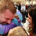SALT LAKE CITY, UT - DECEMBER 14: Staff Sergeant Hyrum Durffy of the Utah National Guard is greeted by his family as he returns home for the holidays at the Salt Lake City International Airport on December 14, 2015 in Salt Lake City, Utah. They are part of the Utah National Guard's 141st Military Intelligence Battalion who is returning form Afghanistan where they have been deployed since last February. (Photo by George Frey/Getty Images