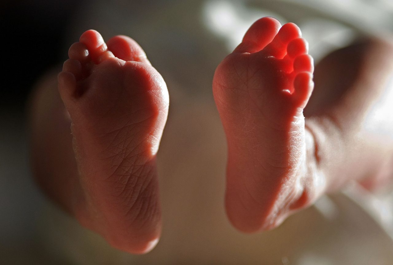 KNUTSFORD, UNITED KINGDOM - APRIL 03: (FILE) In this file photograph taken on March 20, 2007, a two-week-old boy finds his feet in his new world. Health Secretary Patricia Hewitt announced, April 3, 2007 that for the first time, mothers-to-be will have a guarantee that the NHS will provide them with a full range of birthing choices - including home births - and a midwife they know and trust to care for them. (Photo by Christopher Furlong/Getty Images)