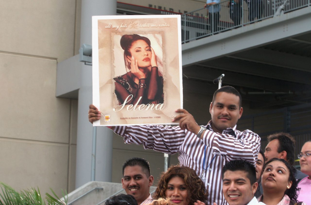 HOUSTON, TX - APRIL 7: Fans of Selena and Latin music wait at the "Selena Vive" tribute concert, April 7, 2005, Reliant Stadium, Houston, Texas. Many of the stars of Latin music and television came to pay their respects and honor the memory of the pop star. (Photo by Jana Birchum/Getty Images)