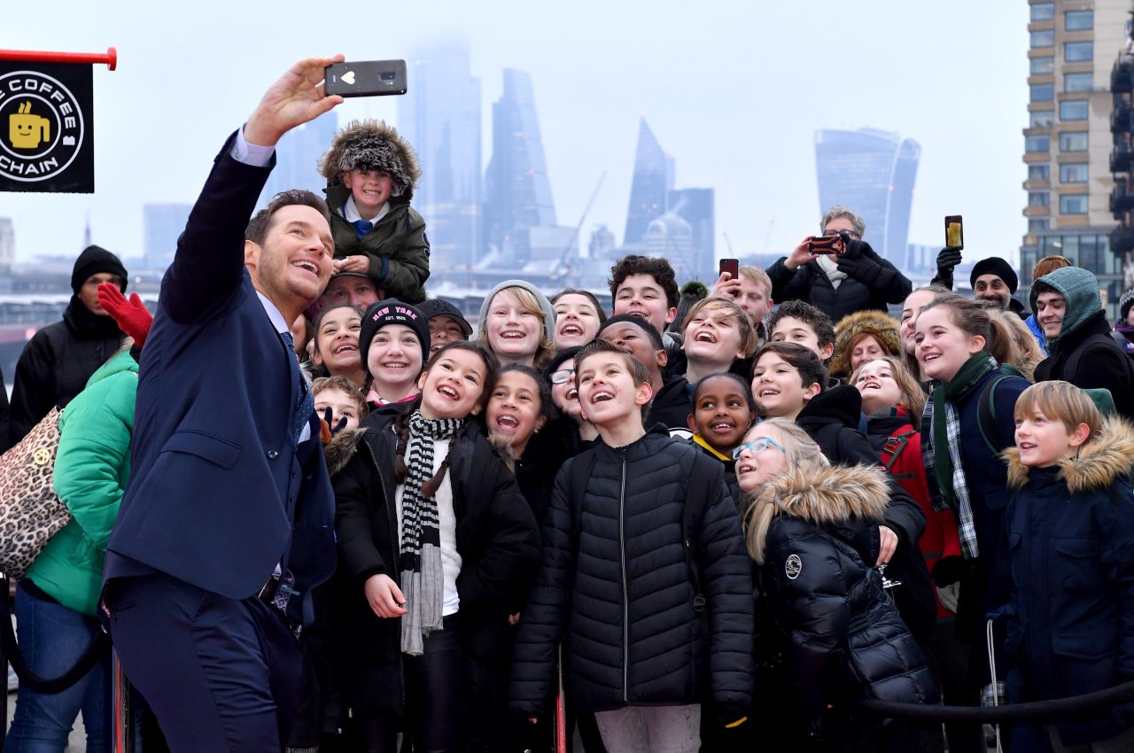 LONDON, ENGLAND - FEBRUARY 01: Chris Pratt takes a selfie with young guests as he attends the opening of the Pop-Up Lego cafe "The Coffee Chain" to celebrate the release of "The Lego Movie 2" at Observation Point on February 01, 2019 in London, England. (Photo by Gareth Cattermole/Getty Images)