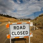WRIGHTWOOD, CA - JULY 23: Traffic is detoured away from a business which closed as California Highway 138 got shut down to protect workers from road rage during a road-widening project on July 23, 2007 near Wrightwood, California, 50 miles northeast of Los Angeles. Before the closure, road workers received insults, death threats, BB gun shootings, and were the target of thrown objects from drivers angered by traffic delays during rush hour. The road is now shut down entirely until the project is finished, forcing 20,000 drivers per day into lengthy detours. (Photo by David McNew/Getty Images)