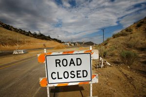 WRIGHTWOOD, CA - JULY 23: Traffic is detoured away from a business which closed as California Highway 138 got shut down to protect workers from road rage during a road-widening project on July 23, 2007 near Wrightwood, California, 50 miles northeast of Los Angeles. Before the closure, road workers received insults, death threats, BB gun shootings, and were the target of thrown objects from drivers angered by traffic delays during rush hour. The road is now shut down entirely until the project is finished, forcing 20,000 drivers per day into lengthy detours. (Photo by David McNew/Getty Images)