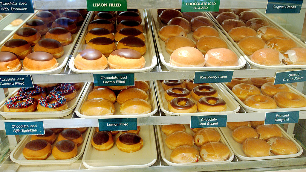 NEW YORK - MAY 28: Krispy Kreme doughnuts are displayed in the front counter of a Krispy Kreme outlet May 28, 2003 in New York City. Increased sales and higher prices at company and franchise stores helped boost quarterly earnings at the the doughnut retailer by nearly 50 percent. (Photo by Stephen Chernin/Getty Images)