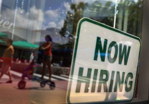 MIAMI BEACH, FL - JULY 05: A ''Now Hiring'' sign is seen in the store front window on July 5, 2012 in Miami Beach, Florida. The ADP released the National Employment Report which showed that employment in the U.S. nonfarm private business sector increased by 176,000 from May to June on a seasonally adjusted basis.The government will release its closely watched employment report for June on Friday. (Photo by Joe Raedle/Getty Images)