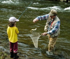 VOLANT, PA - APRIL 17: Sarah Tierno, 7, catches her first-ever trout with help from her father, Gary Tierno, on the Neshannock Creek April 17, 2004 near Volant, Pennsylvania. The Tiernos were among thousands of anglers across Pennsylvania to cast their lines on Saturday, the first day of trout fishing season. (Photo by Mark Stahl/Getty Images)