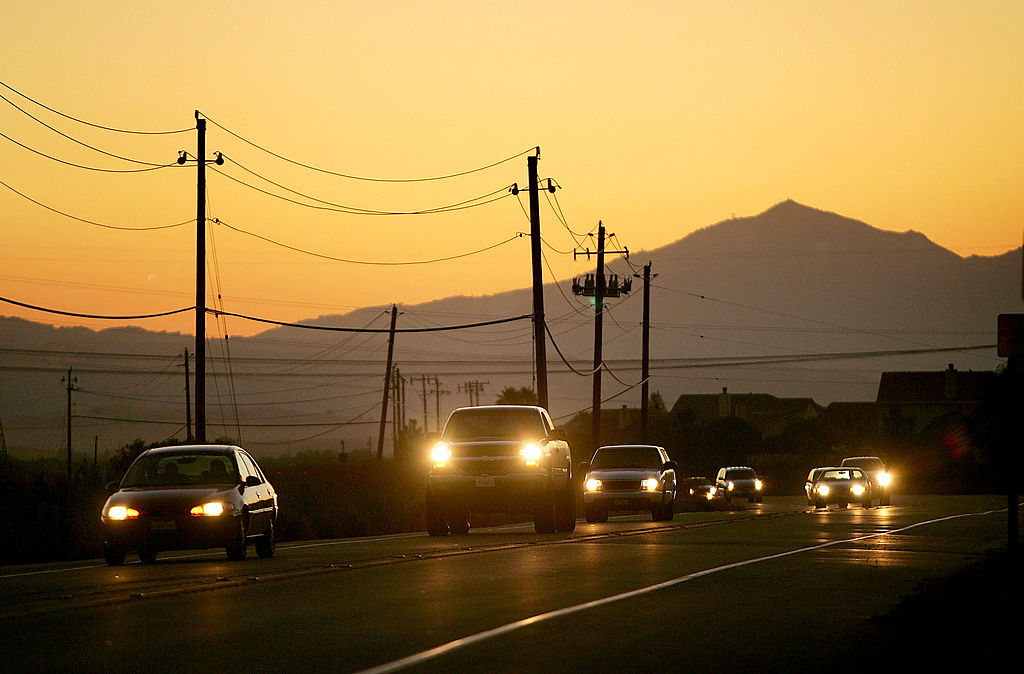 STOCKTON, CA - SEPTEMBER 28: Night falls as traffic on Highway 4 passes the community of Discovery Bay, one of the residential islands surrounded by levees that hold back higher the waters of the Sacramento-San Joaquin River Delta, on September 28, 2005 west of Stockton, California. Officials say that the dikes of the Sacramento-San Joaquin River Delta are in worse shape than those that broke and flooded New Orleans during Hurricane Katrina. There is a two-in-three chance that a catastrophic earthquake or storm in the next 50 years will damage the levees enough to cause the kind destruction that engulfed New Orleans, according to experts. Such an event would affect the water supply that serves two-thirds of California and create a nightmare traffic jam on Highway 4, the two-lane road that would be the major evacuation route, if it is not damaged beyond usability. 1,600 miles of levees protect the delta?s islands, which lie well below sea-level, and most were built more than 100 years ago. (Photo by David McNew/Getty Images)