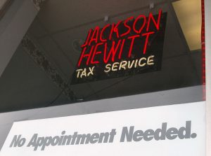 401960 05: A sign stating "No Appointment Needed" is displayed in a window at a Jackson Hewitt tax service preparation office March 6, 2002 in Mount Prospect, IL. The normal IRS (Internal Revenue Service) tax deadline is April 15, 2002 unless you live in New England, where your deadline is April 16, due to Patriots Day, a federal holiday. These New England states include New York (except New York City, and counties of Nassau, Rockland, Suffolk, and Westchester), Connecticut, Maine, Massachusetts, New Hampshire, Rhode Island, and Vermont. (Photo by Tim Boyle/Getty Images)