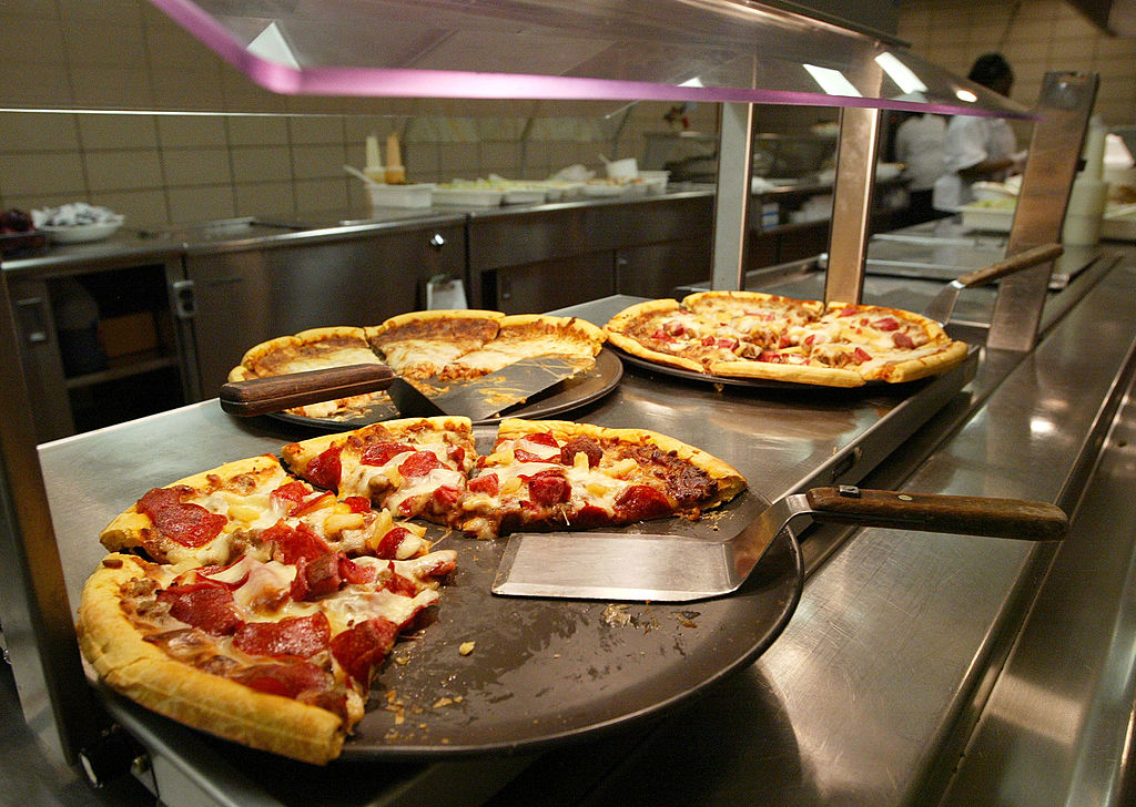 CHICAGO - APRIL 20: Pizzas available for lunch are seen in the kitchen at Jones College Prep High School April 20, 2004 in Chicago, Illinois. The Chicago Public School system will introduce next fall a new vending policy restricting junk food and a new beverage contract banning carbonated drinks. (Photo by Tim Boyle/Getty Images)